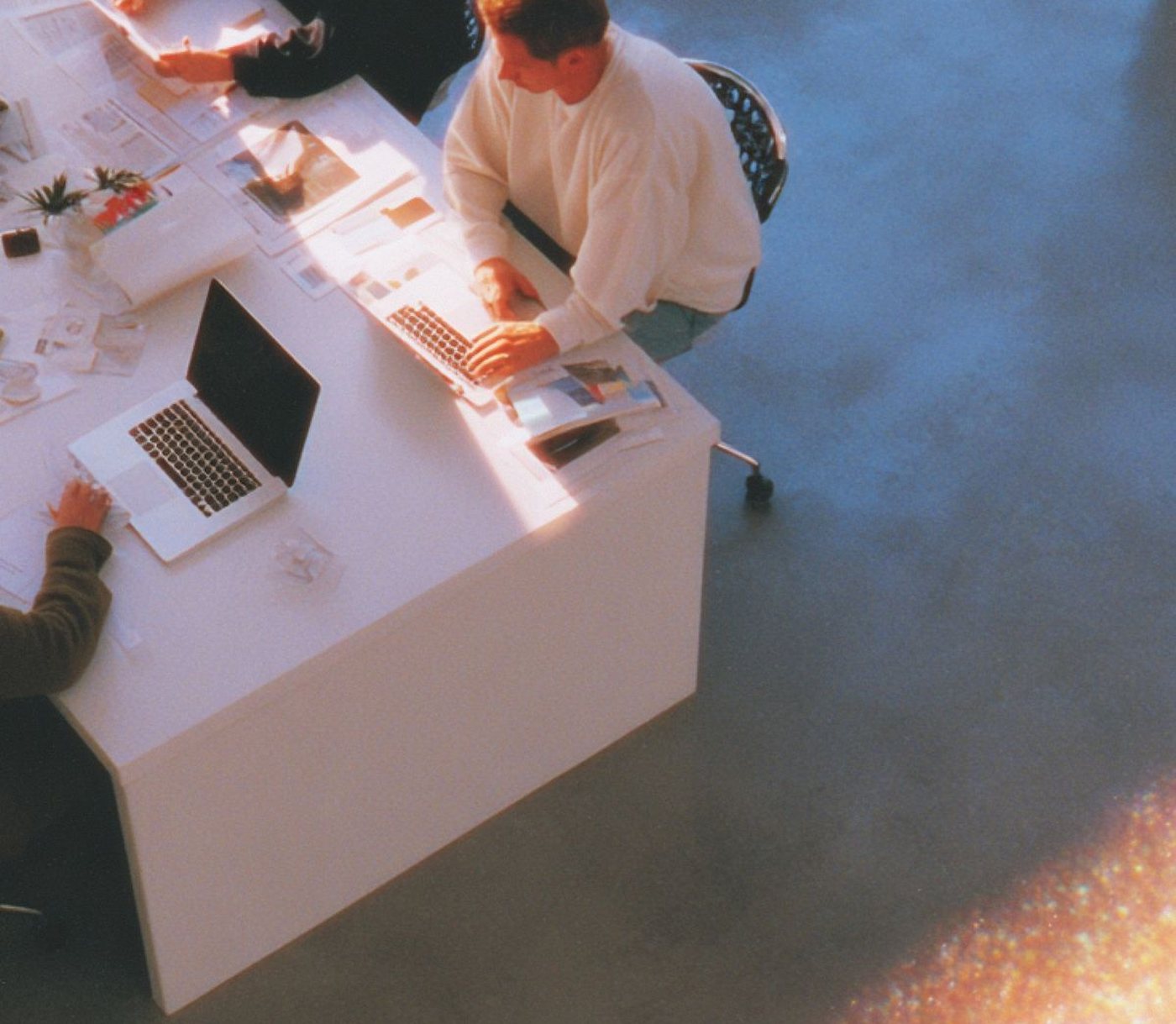 Founders working together around a table at a small off-site session.